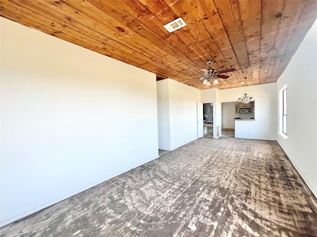 unfurnished living room with visible vents, wood finished floors, ceiling fan with notable chandelier, and wood ceiling