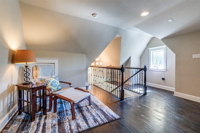 living area with recessed lighting, wood finished floors, an upstairs landing, baseboards, and lofted ceiling