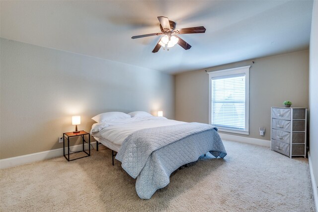 bedroom with baseboards, a ceiling fan, and carpet floors