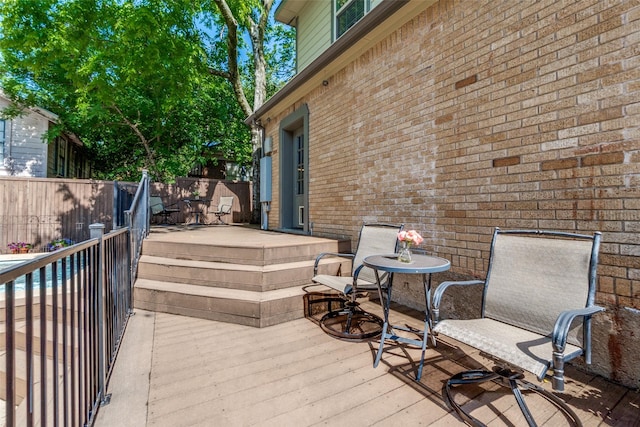 wooden deck featuring fence