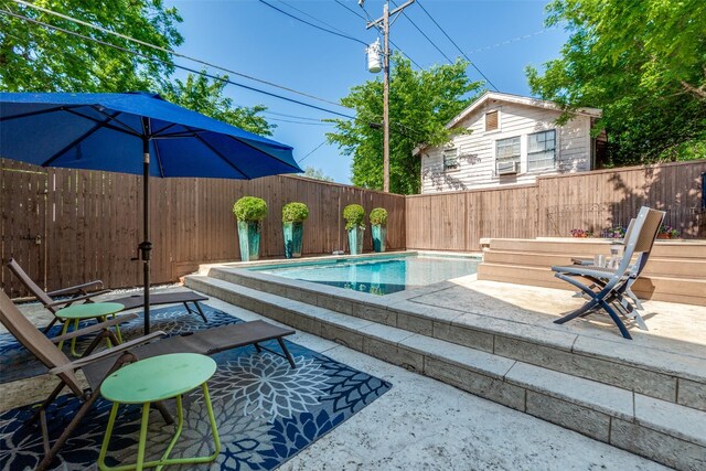 view of pool with a fenced in pool, a patio area, and a fenced backyard