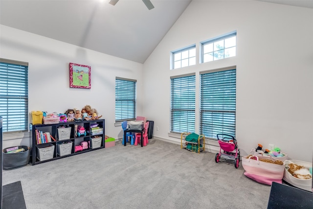 playroom featuring carpet flooring, a ceiling fan, and high vaulted ceiling