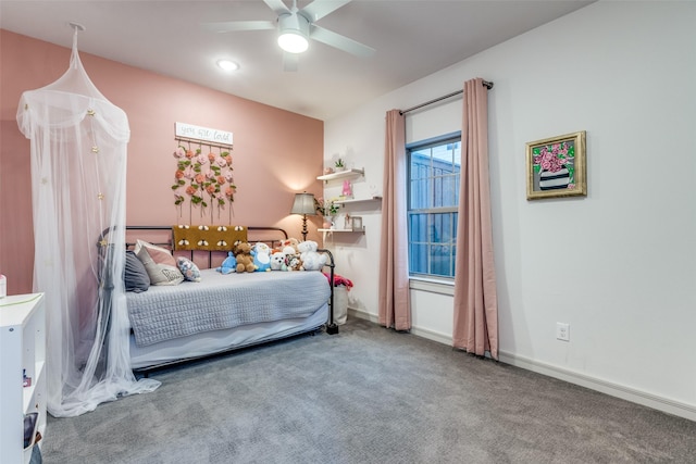 carpeted bedroom with ceiling fan and baseboards