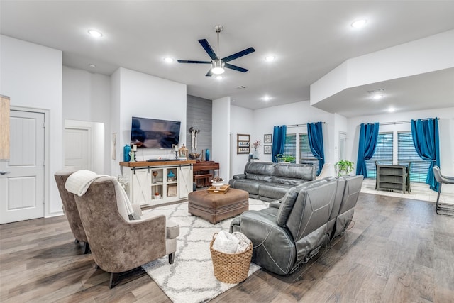 living room featuring recessed lighting, ceiling fan, and wood finished floors