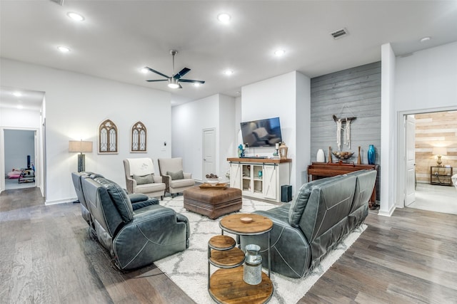 living room featuring wood finished floors, visible vents, ceiling fan, and recessed lighting