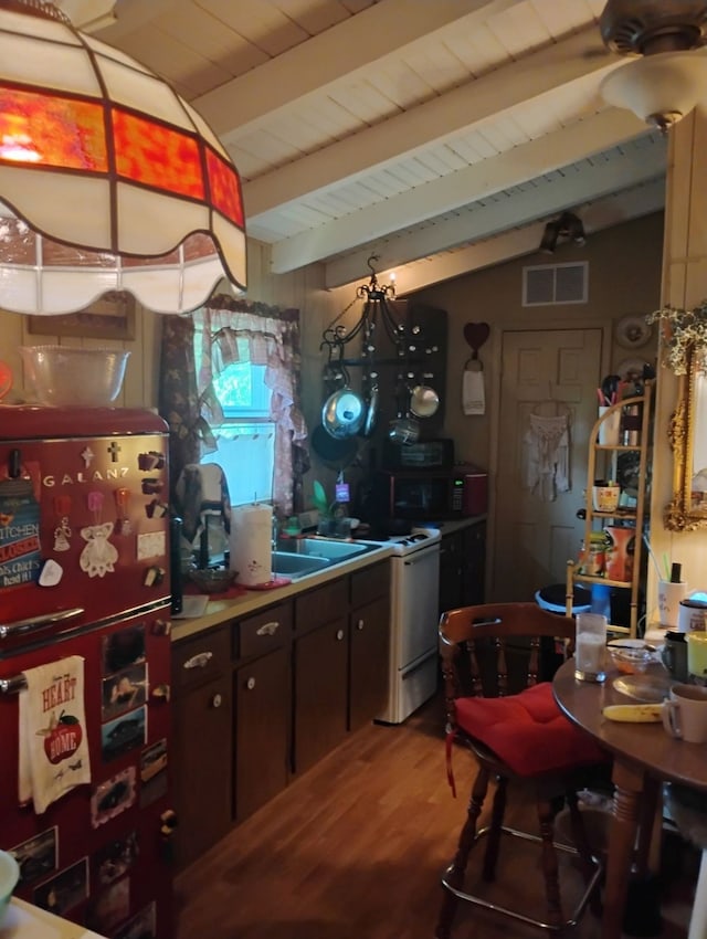 kitchen featuring white range with electric stovetop, visible vents, freestanding refrigerator, wooden ceiling, and wood finished floors