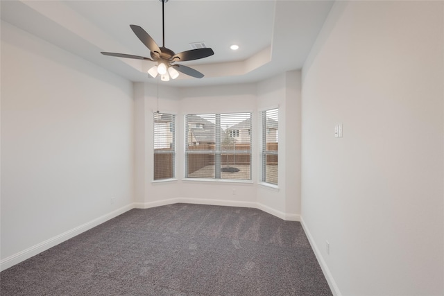 unfurnished room with recessed lighting, a ceiling fan, dark carpet, and baseboards