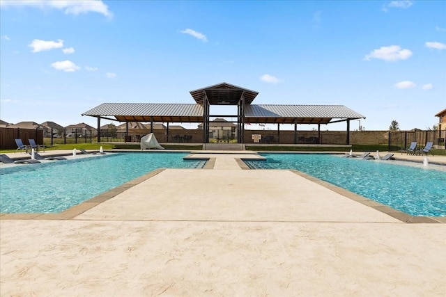 view of swimming pool with a patio, a gazebo, and fence
