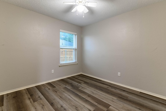 unfurnished room with dark wood finished floors, baseboards, ceiling fan, and a textured ceiling