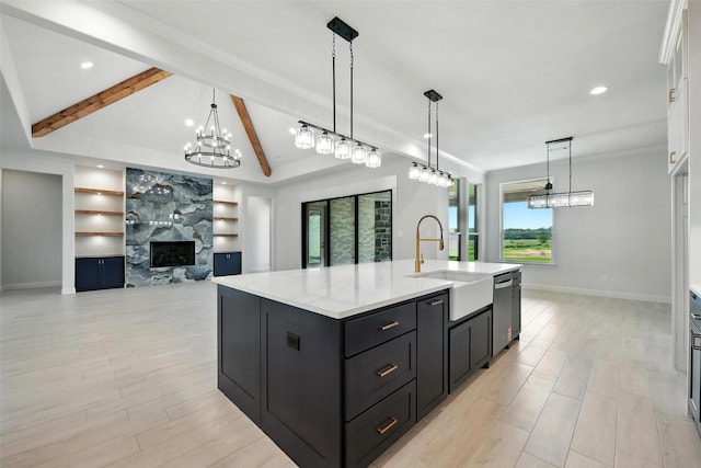 165 Rio Rancho Dr, Decatur, TX 76234 - kitchen with dishwasher, a chandelier, white cabinets, built in shelves, and a fireplace