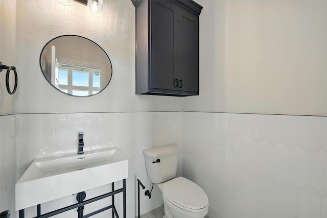 165 Rio Rancho Dr, Decatur, TX 76234 - half bath featuring tile walls and wainscoting