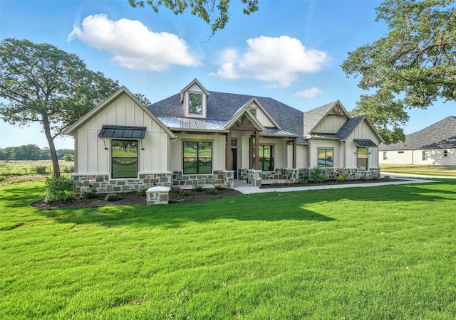 165 Rio Rancho Dr, Decatur, TX 76234 - modern farmhouse with board and batten siding, a standing seam roof, a porch, and a front lawn