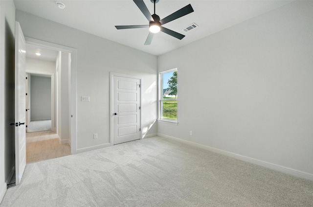 165 Rio Rancho Dr, Decatur, TX 76234 - unfurnished bedroom with light carpet and ceiling fan