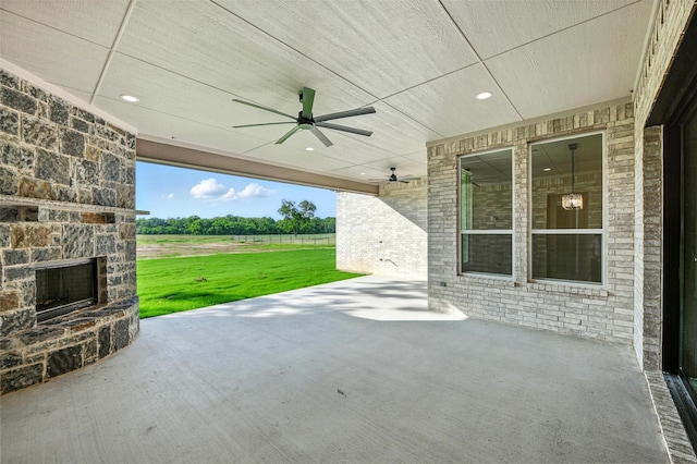165 Rio Rancho Dr, Decatur, TX 76234 - view of patio / terrace with a ceiling fan and an outdoor stone fireplace