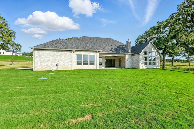 165 Rio Rancho Dr, Decatur, TX 76234 - back of house with a lawn, a patio, and a chimney