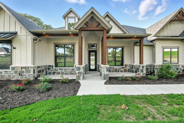 165 Rio Rancho Dr, Decatur, TX 76234 - craftsman-style home featuring stone siding, covered porch, and board and batten siding