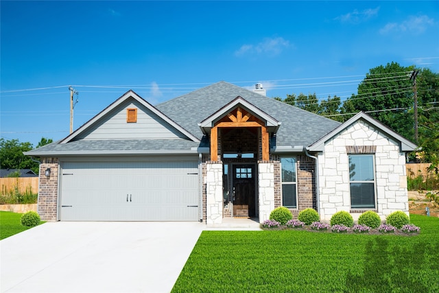 3919 Rose Hill Ct, Denison, TX 75020 - craftsman-style home featuring concrete driveway, stone siding, a shingled roof, an attached garage, and a front lawn