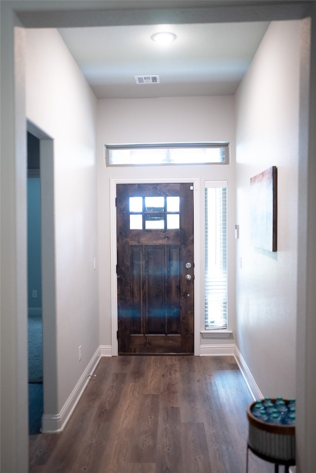 3919 Rose Hill Ct, Denison, TX 75020 - entryway with dark wood-type flooring, visible vents, and baseboards