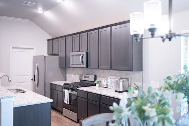 3919 Rose Hill Ct, Denison, TX 75020 - kitchen with light stone countertops, a sink, stainless steel appliances, tasteful backsplash, and visible vents