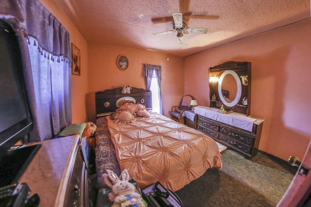 bedroom featuring a ceiling fan, a textured ceiling, and carpet flooring