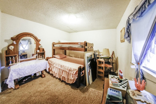 carpeted bedroom featuring a textured ceiling