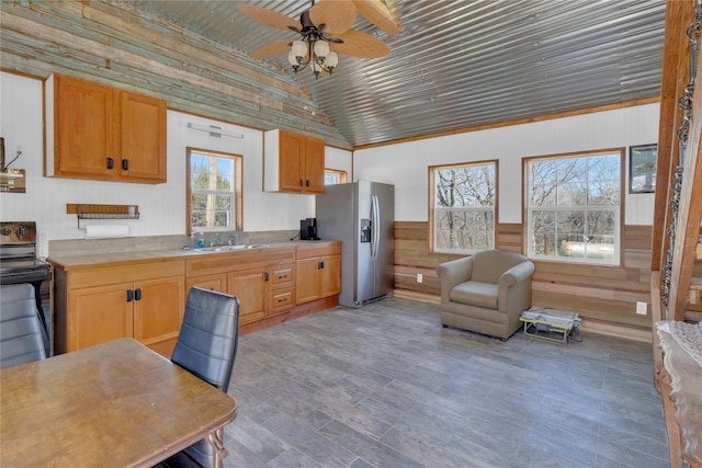 4403 Fm-205, Glen Rose, TX 76043 - kitchen with a sink, ceiling fan, stainless steel refrigerator with ice dispenser, wood walls, and black electric range