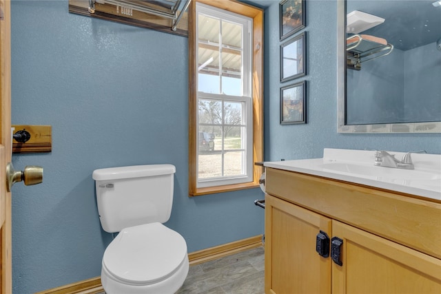 4403 Fm-205, Glen Rose, TX 76043 - bathroom featuring toilet, a textured wall, vanity, and baseboards