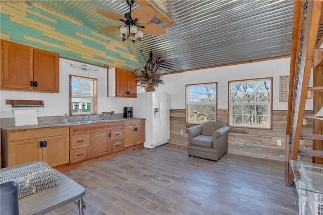 4403 Fm-205, Glen Rose, TX 76043 - kitchen with a sink, white refrigerator with ice dispenser, wooden walls, vaulted ceiling, and a ceiling fan