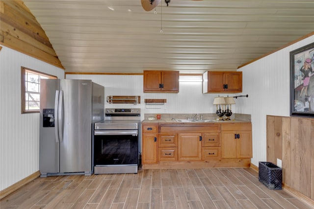 4403 Fm-205, Glen Rose, TX 76043 - kitchen with a sink, light wood-style floors, baseboards, appliances with stainless steel finishes, and lofted ceiling