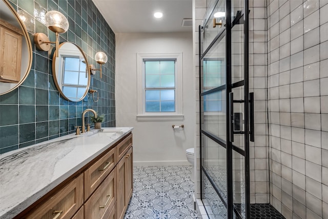 521 Texas St, Denton, TX 76209 - bathroom featuring vanity, tile patterned floors, plenty of natural light, and a stall shower