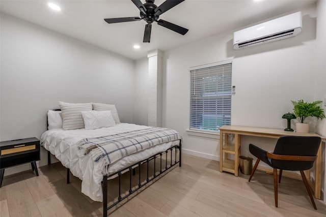 521 Texas St, Denton, TX 76209 - bedroom with a wall unit AC, a ceiling fan, light wood-type flooring, baseboards, and recessed lighting