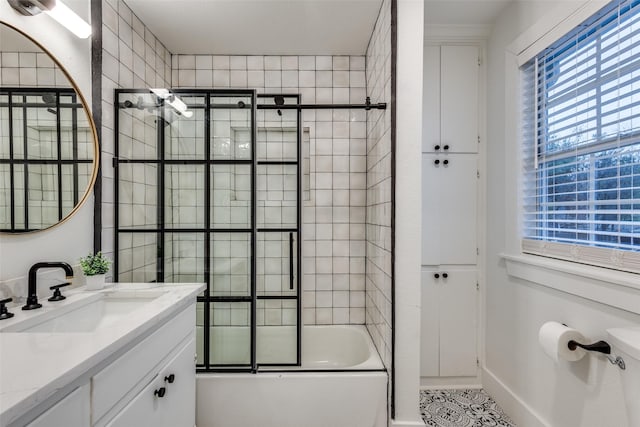 full bathroom with enclosed tub / shower combo and vanity