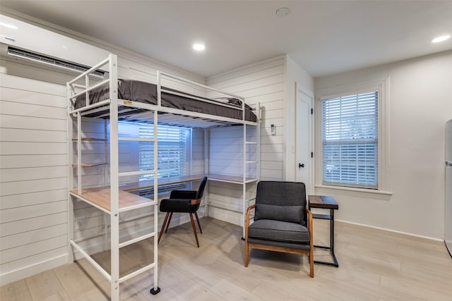 bedroom with recessed lighting, multiple windows, and wood finished floors