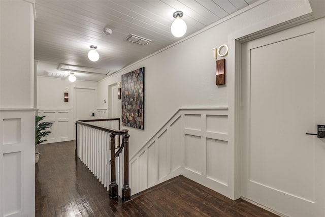 521 Texas St, Denton, TX 76209 - staircase with wood-type flooring, visible vents, a wainscoted wall, and a decorative wall