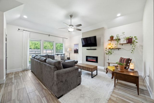 4435 Cicero St, Dallas, TX 75216 - living area featuring baseboards, recessed lighting, a ceiling fan, and a glass covered fireplace