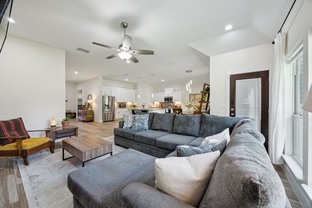 4435 Cicero St, Dallas, TX 75216 - living room with light wood finished floors, recessed lighting, visible vents, and ceiling fan