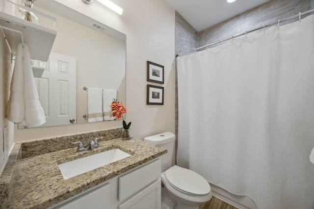 4435 Cicero St, Dallas, TX 75216 - bathroom featuring visible vents, toilet, a shower with curtain, and vanity