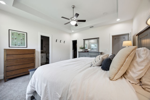 4435 Cicero St, Dallas, TX 75216 - carpeted bedroom with ceiling fan, a raised ceiling, ensuite bathroom, visible vents, and recessed lighting