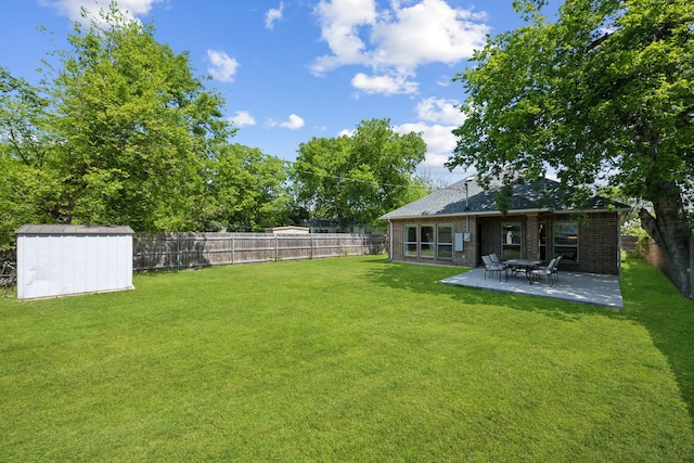 4435 Cicero St, Dallas, TX 75216 - view of yard with a storage unit, a patio, an outdoor structure, and a fenced backyard