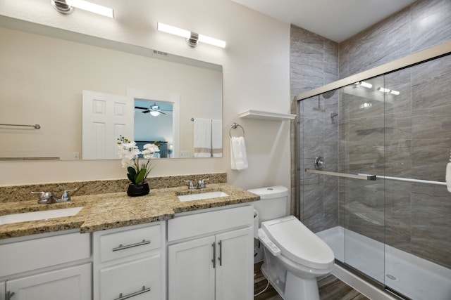 4435 Cicero St, Dallas, TX 75216 - bathroom featuring toilet, a sink, and a shower stall