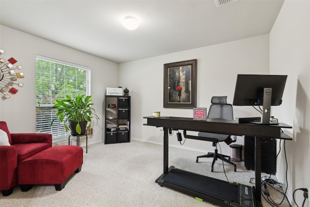 carpeted office space with baseboards