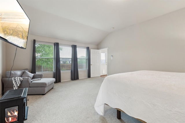 carpeted bedroom featuring vaulted ceiling