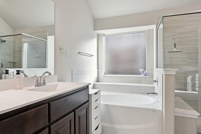 full bath with a stall shower, a garden tub, and vanity