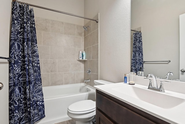 bathroom with toilet, shower / bath combo, and vanity