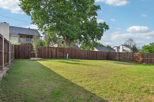 view of yard with a fenced backyard
