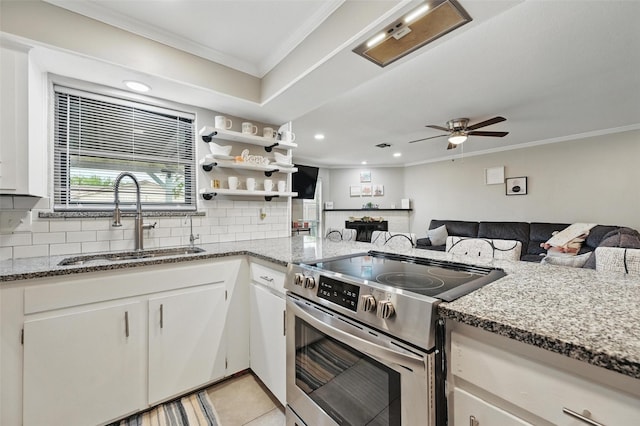 1501 SE 4th St, Grand Prairie, TX 75051 - kitchen with stainless steel electric range, ornamental molding, tasteful backsplash, light stone countertops, and a ceiling fan