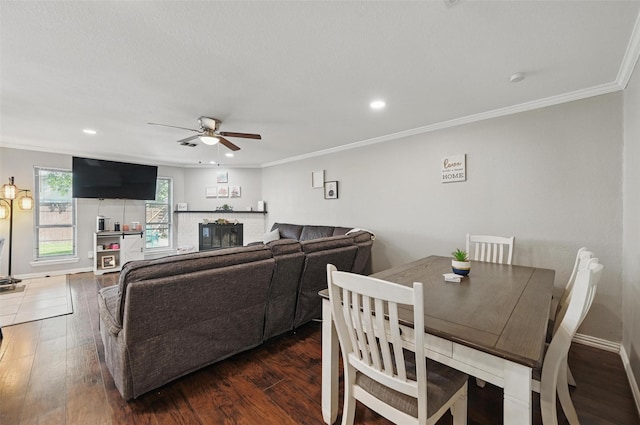 1501 SE 4th St, Grand Prairie, TX 75051 - living room featuring ceiling fan, a fireplace, ornamental molding, wood finished floors, and recessed lighting