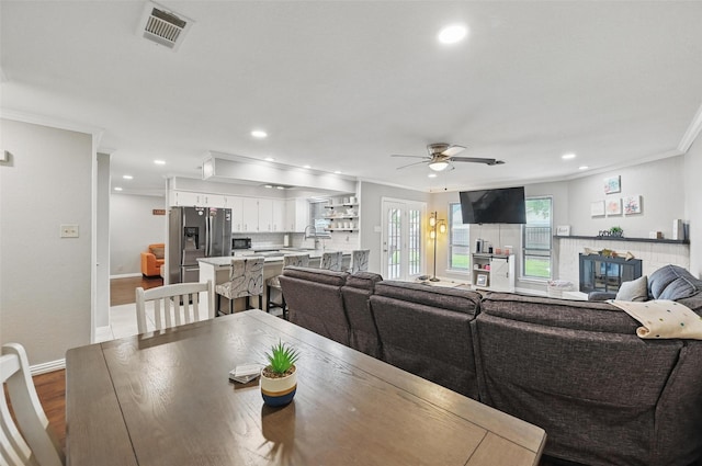 1501 SE 4th St, Grand Prairie, TX 75051 - dining area featuring crown molding, ceiling fan, recessed lighting, and dark wood-style floors