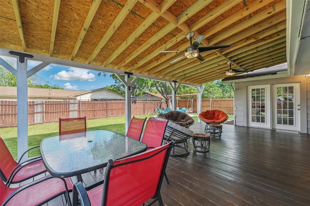 1501 SE 4th St, Grand Prairie, TX 75051 - deck with outdoor dining space, a fenced backyard, and a ceiling fan