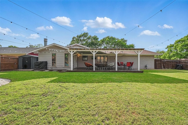 1501 SE 4th St, Grand Prairie, TX 75051 - rear view of property with a fenced backyard, a storage shed, and a patio area